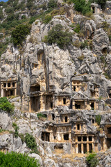View of the Lycian tombs in the ancient city of Myra, climbed on the mountain on a sunny day.
