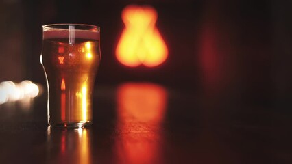 Beer with bubbles and foam in glass