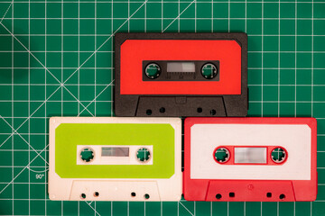 Obraz premium audio cassette tapes on green background