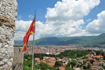 View over Ohrid in Macedonia on a sunny summer day. Macedonian flag next to the wall of Samuel's fortress.