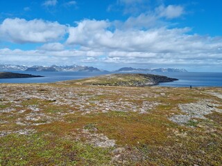 Fototapeta na wymiar Porsangervika in Finnmark. The small island with german fortification remains from the second world war