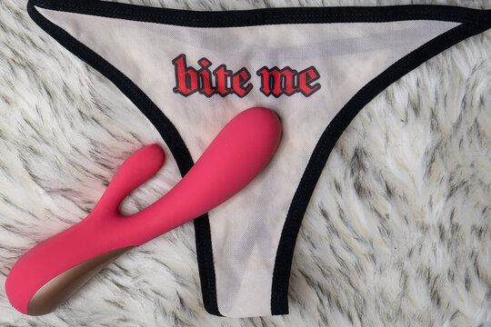 woman's sexy white underwear with word bite me print, on the