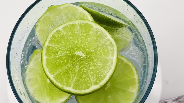 Extreme close up slow motion of  lime soda fizzy drink.