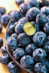 Fresh blueberries on a wooden background