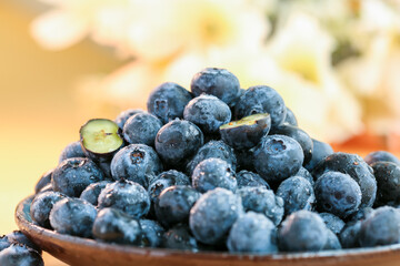 Fresh blueberries on a wooden background