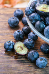 Fresh blueberries on a wooden background