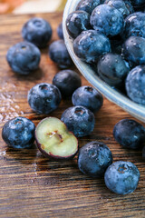 Fresh blueberries on a wooden background