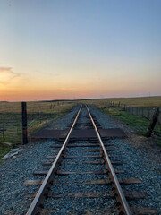 Fototapeta na wymiar Train tracks at Sunset in the Country in California