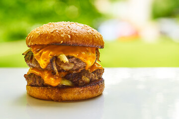Oklahoma style onion burger on summer outdoor background