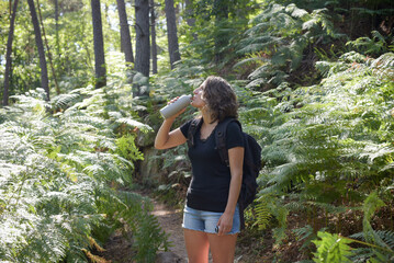 caucasian woman hiking in french forest