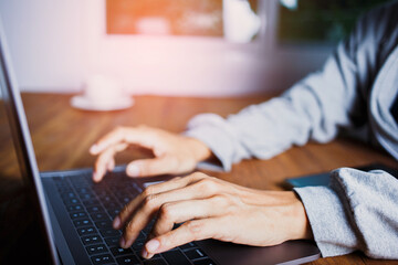 Hand of a man typing and searching to learning and researching course tutor education, online on a...