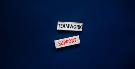 Teamwork support symbol. Concept words Teamwork support on wooden blocks on a beautiful black table black background. Business and teamwork support concept. Copy space.