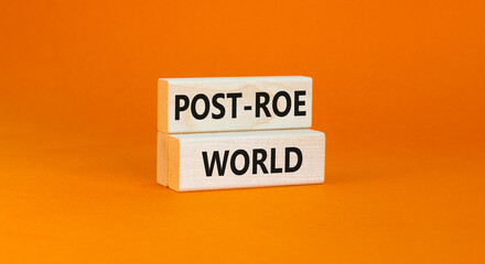 Roe vs Wade post-Roe world symbol. Concept words Post-Roe world on wooden blocks on a beautiful orange table orange background. Business and Roe vs Wade post-Roe world concept. Copy space.
