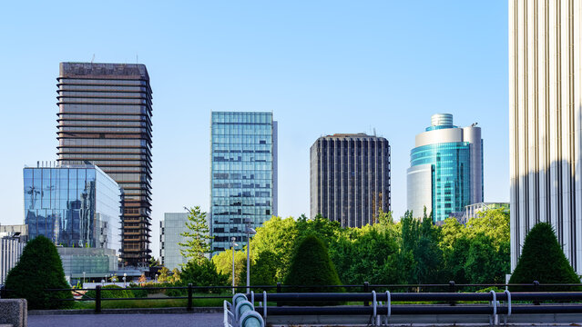 Modern steel and glass buildings lined up on the horizon in the financial district of the city of Madrid, Spain.