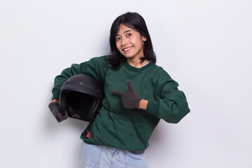 beautiful asian woman with a motorcycle helmet showing a thumbs up ok gesture on white background
