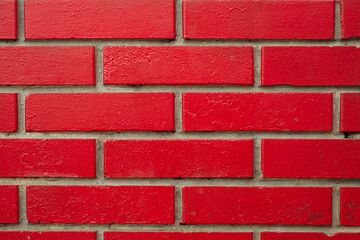 Obraz premium Bricks painted red. Texture, background for design, backdrop.