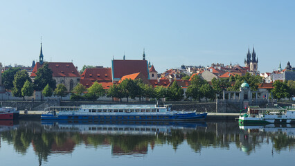 Na Františku, district of Old Town of Prague with cruise ships docked in foreground and buildings...