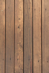 Fototapeta premium Brown wooden slats, worn texture, vertical photo