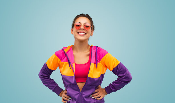 Happy sportswoman in colorful activewear