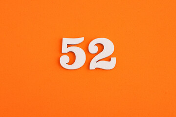 Number 52 - On orange foam rubber background