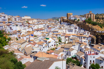 Setenil de las Bodegas. Typical andalucian village with white houses and sreets with dwellings built into rock overhangs above Rio Trejo. Andalusia. Spain © gatsi