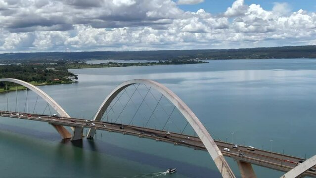 Aerial view of traffic on JK Bridge (Portuguese: Ponte JK ), a steel and concrete arch bridge across Lake Paranoa in Brasilia, capital of Brazil.