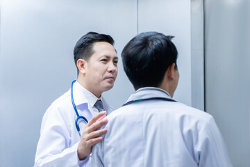 Two doctors consulted the patient's case to keep the patient safe at the hospital.