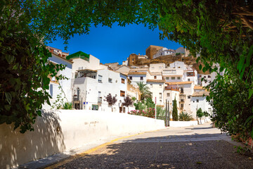 Setenil de las Bodegas. Typical andalucian village with white houses and sreets with dwellings built into rock overhangs above Rio Trejo. Andalusia. Spain © gatsi