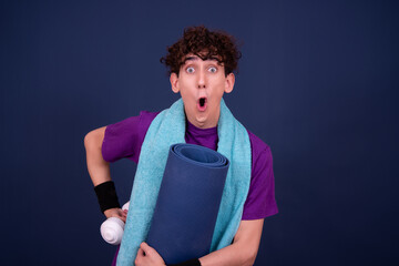 Fitness and healthy lifestyle. Athletic funny guy. Blue background.	