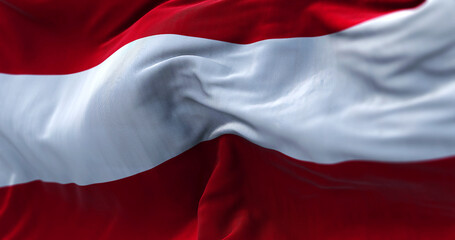 Close-up view of the austrian national flag waving in the wind