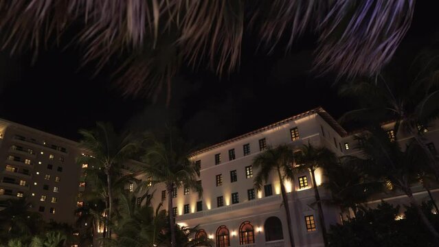 Beautiful view of lightened buildings and trees moving of the wind in Condado Puerto Rico at night