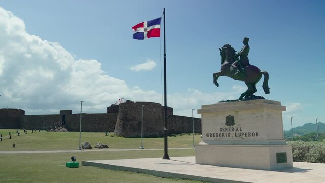 Dominican Republic flag and statue of General Gregorio Luperon in the Dominican Republic