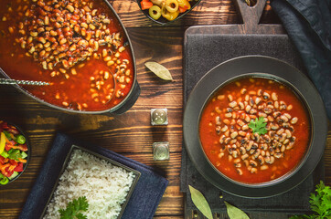 Arabic Cuisine; Middle Eastern traditional black- eyed beans in tomato sauce. Served with white rice and oriental pickles and green salad.