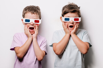 Astonished kids in 3D glasses in studio