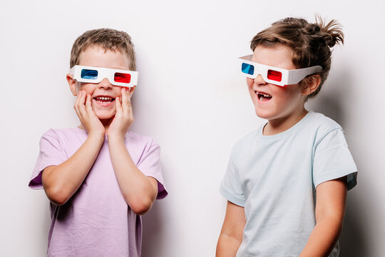 Astonished kids in 3D glasses in studio