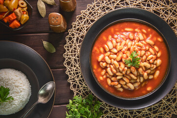 Arabic Cuisine; Middle Eastern traditional white beans in tomato sauce. Served with white rice and...