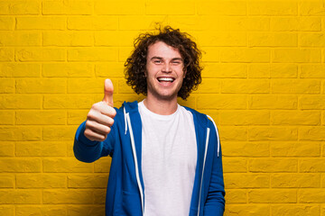 Happy man showing thumb up gesture