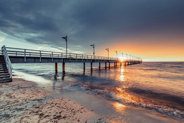 pier at sunset in Mechelinki - 521284138