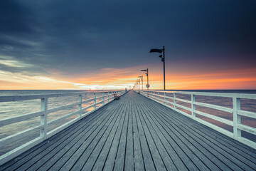 pier at sunset in Mechelinki - 521284140