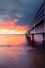 pier at sunset in Mechelinki - 521284147
