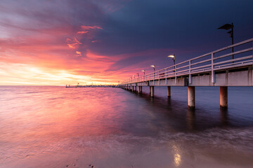 pier at sunset in Mechelinki - 521284148