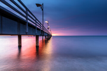 pier at sunset in Mechelinki - 521284152