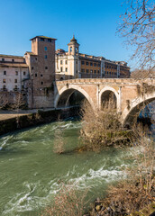 Tiber Island and Fabricio's Bridge as seen from the riverside, Rome, Italy.