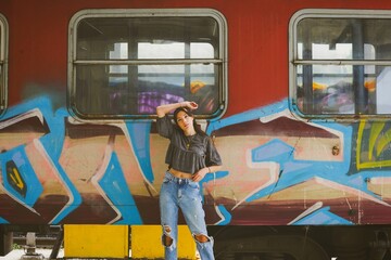 portrait of a woman with graffiti train