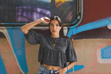 portrait of a woman with graffiti train