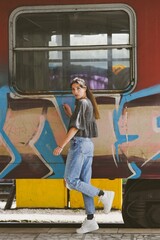 Fototapeta na wymiar portrait of a woman with graffiti train