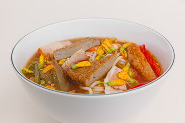 Bun mam, Vietnamese rice noodle soup with shrimp fish paste, Vietnamese food isolated on white background, perspective view