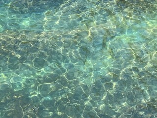 Clear sea water glittering surface. Beautiful seascape.