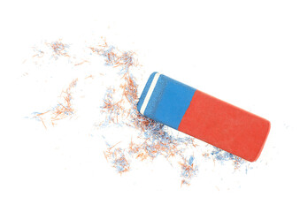 Red and blue eraser with eraser shavings isolated on a white background, top view. Office supply for erasing mistakes.