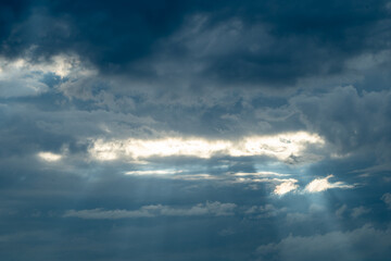 Naklejka na ściany i meble Sun beam through dark clouds/ There's always Hope